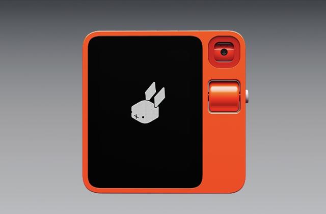 Rabbit R1 device against a gray background