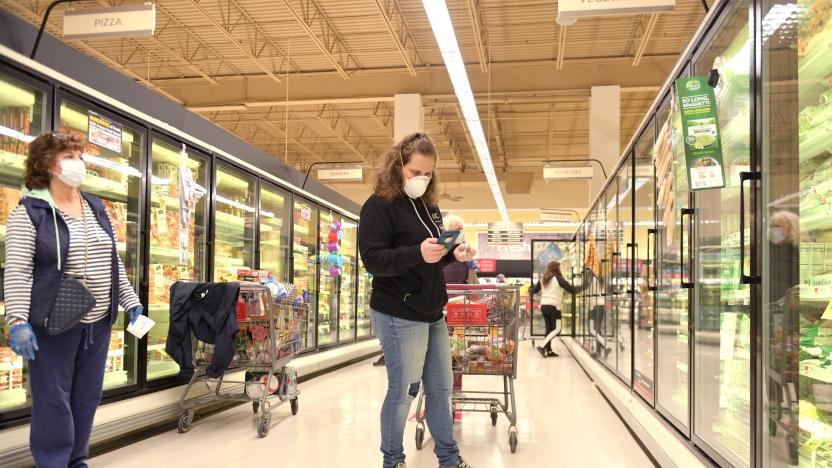 CLARK, NEW JERSEY - APRIL 27: Clark resident Jen Valencia (C) shops for a customer as she supplements her income working for Instacart at Acme Market on April 27, 2020 in Clark, New Jersey. Instacart has experienced a massive surge in customer demand and employment recently due to lockdowns and other restrictions caused by COVID-19. (Photo by Michael Loccisano/Getty Images)