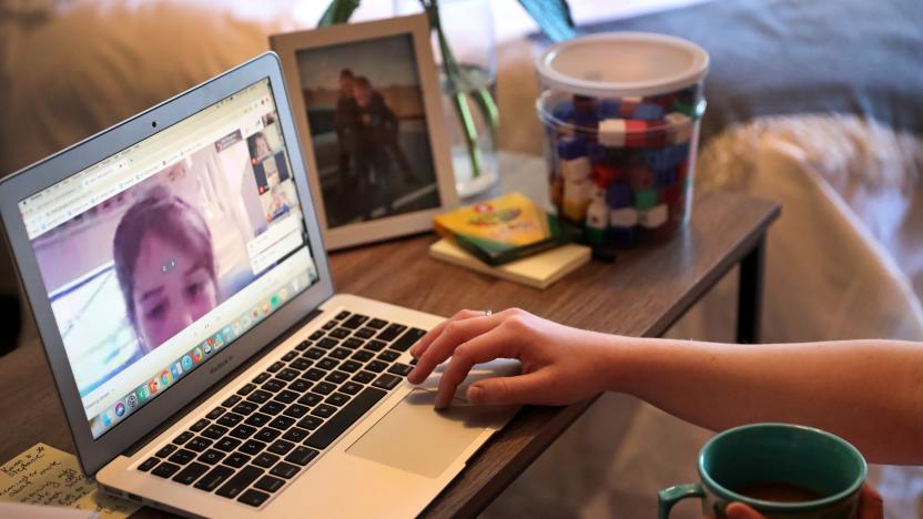 BROOKLINE, MA - MARCH 27: Ellie Lyons, an elementary school teacher, meets with her Natick first-grade students on Google Meet from her home in Brookline, MA on March 27, 2020. She has converted the backdrop of the bedroom in her Brookline apartment into a makeshift first-grade classroom to make her students more comfortable. Suburban schools are converting to online education as rapidly as possible as some parents demand more formalized schooling amid the shutdown. (Photo by David L. Ryan/The Boston Globe via Getty Images)