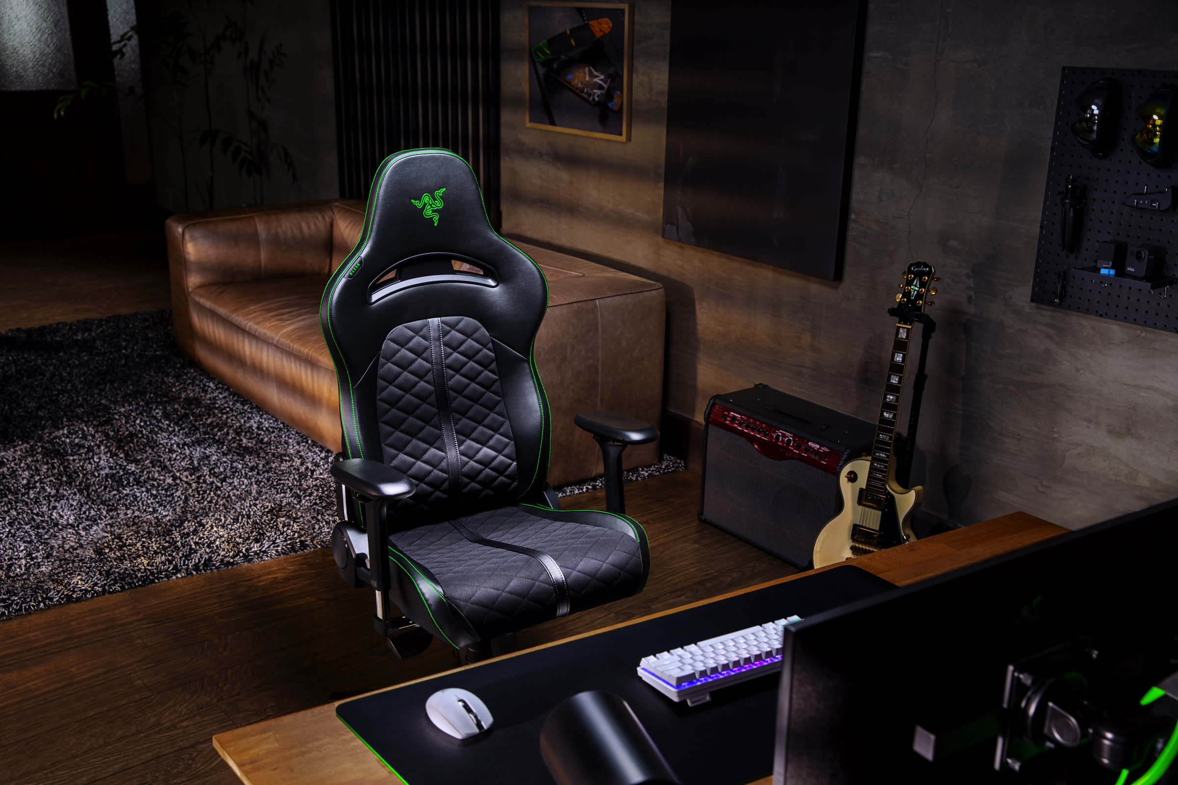 Product image of Enki in a room with a gaming desktop, guitar and couch