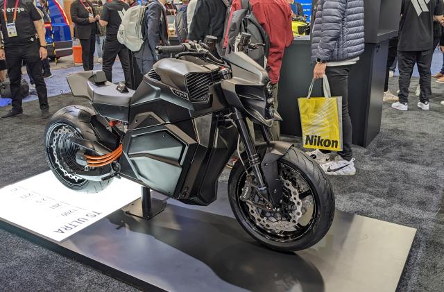 a black electric motorcycle with a hubless rear wheel