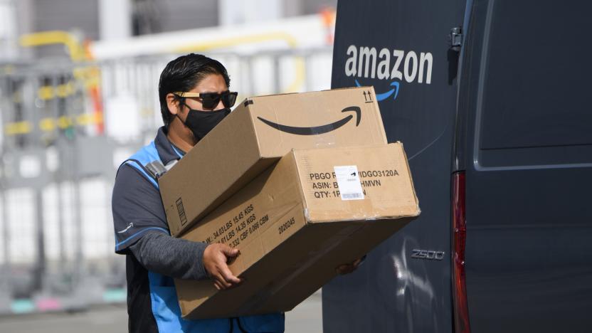 An Amazon.com Inc. delivery driver carries boxes into a van outside of a distribution facility on February 2, 2021 in Hawthorne, California. - Jeff Bezos said February 1, 2021, he would give up his role as chief executive of Amazon later this year as the tech and e-commerce giant reported a surge in profit and revenue in the holiday quarter. The announcement came as Amazon reported a blowout holiday quarter with profits more than doubling to $7.2 billion and revenue jumping 44 percent to $125.6 billion. (Photo by Patrick T. FALLON / AFP) (Photo by PATRICK T. FALLON/AFP via Getty Images)