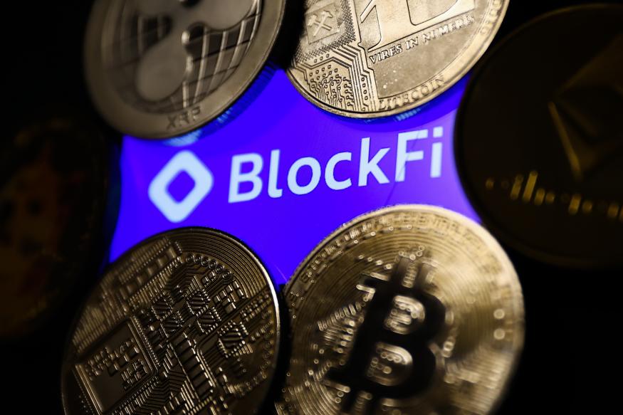 BlockFi logo displayed on a phone screen and representaation of cryptocurrencies are seen in this illustration photo taken in Krakow, Poland on November 14, 2022. (Photo by Jakub Porzycki/NurPhoto via Getty Images)