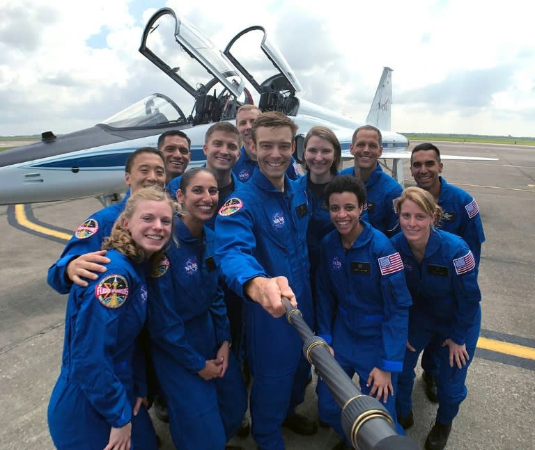 In this June 2017 photo obtained from NASA, then-neophyte astronaut candidates including Jasmin Moghbeli (fourth from left) stopped to pose for a picture while getting fitted for flight suits at Ellington Field near Johnson Space Center in Houston, Texas (AFP Photo/HO)