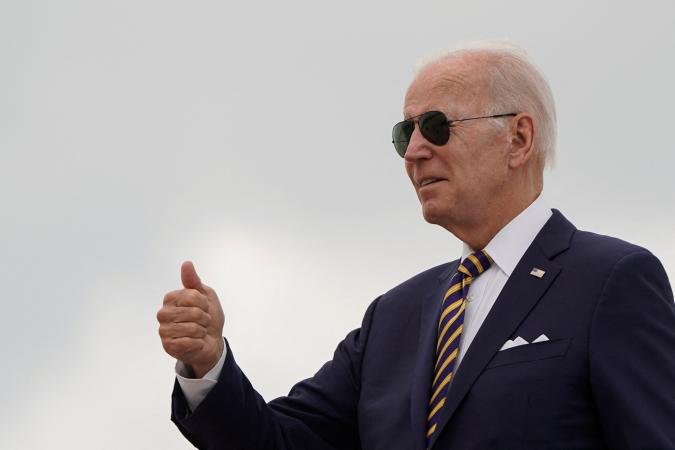 U.S. President Joe Biden gives a thumbs up as he boards Air Force One to depart for Kiawah Island, South Carolina, from Joint Base Andrews in Maryland, U.S., August 10, 2022. REUTERS/Joshua Roberts
