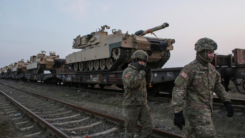 US soldiers walk next to M1 Abrams tanks at the Mihail Kogalniceanu Air Base,  Romania, February 14, 2017. Inquam Photos/Octav Ganea/via REUTERS ATTENTION EDITORS - THIS IMAGE WAS PROVIDED BY A THIRD PARTY. EDITORIAL USE ONLY. ROMANIA OUT. NO COMMERCIAL OR EDITORIAL SALES IN ROMANIA