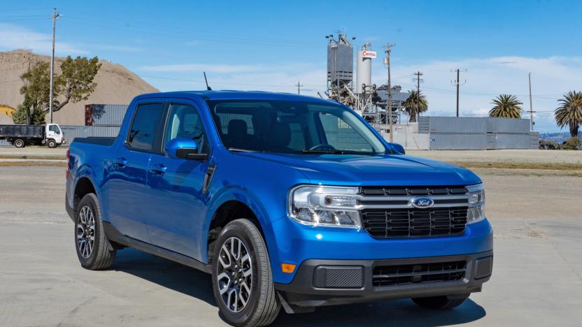 A blue Ford 2022 Maverick pickup sits in an empty parking lot.