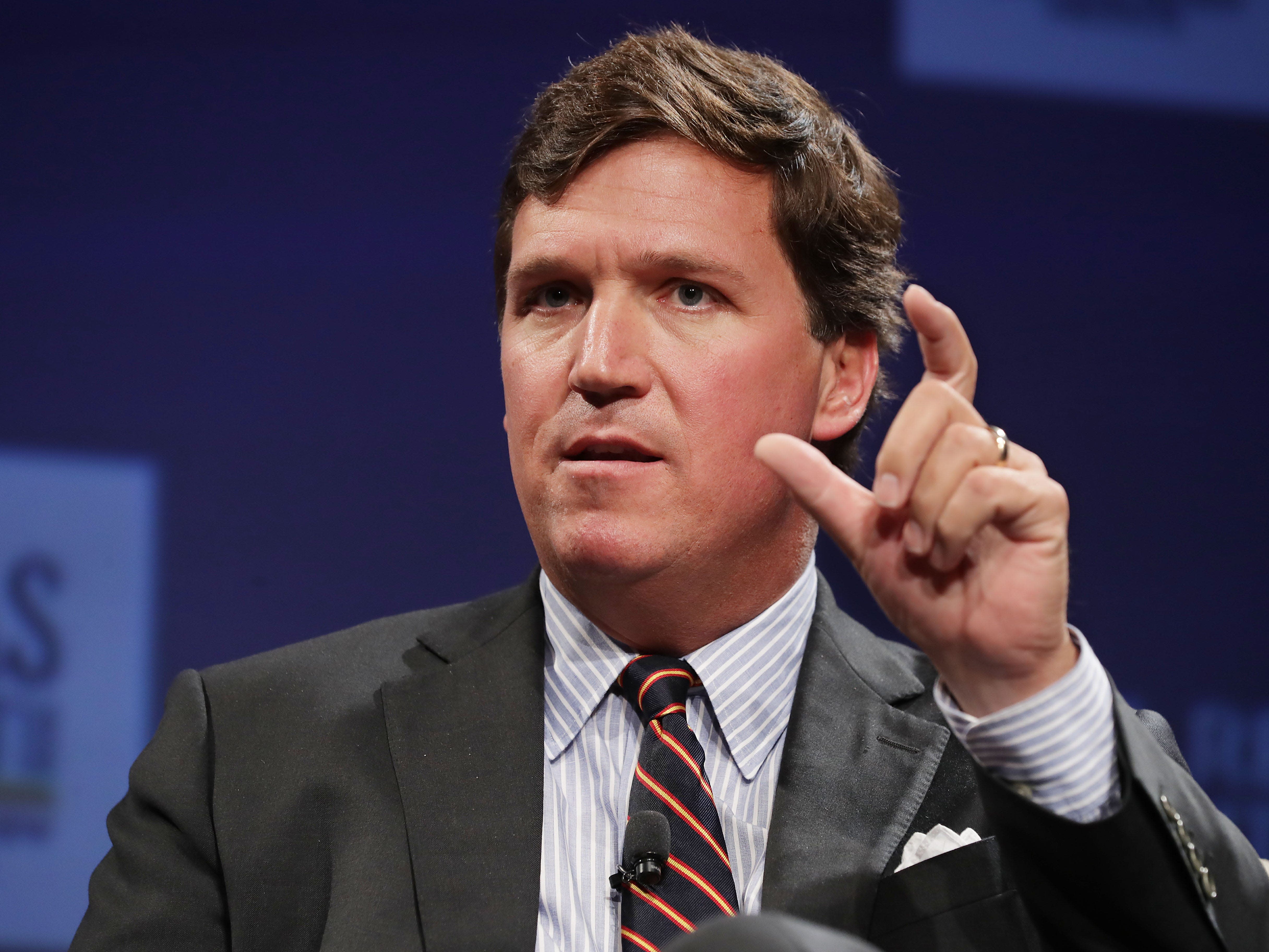 Tucker Carlson says he 'could care less' if people say he's a 'pawn of Putin,' as he echoes Russian propaganda on Ukraine