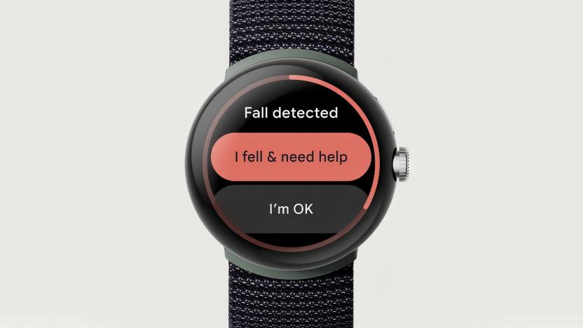 Closeup of the Google Pixel Watch with fall detection on the screen. It has the title "Fall detected" with two buttons: "I fell & need help" and "I'm OK." Off-white background.