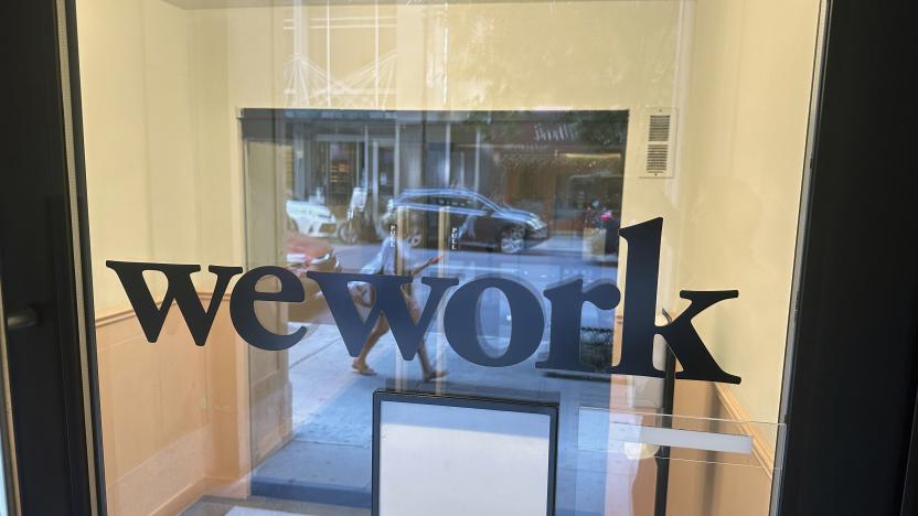 FILE - A sign for WeWork is displayed at their office in the borough of Manhattan in New York, Aug. 9, 2023. Trading in shares of WeWork were halted Monday as rumors that the office sharing company will seek bankruptcy protection. (AP Photo/Ted Shaffrey, File)