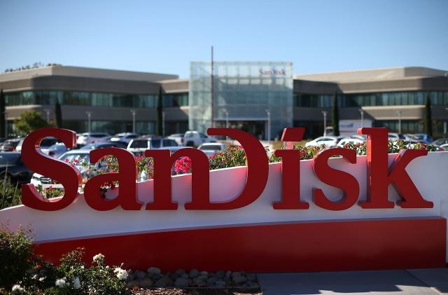 MILPITAS, CA - OCTOBER 21:  A sign is posted in front of the SanDisk headquarters on October 21, 2015 in Milpitas, California. Computer data storage company Western Digital announced plans to acquire flash memory storage maker SanDisk for $19 billion.  (Photo by Justin Sullivan/Getty Images)