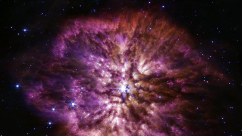 The luminous, hot star Wolf-Rayet 124 is prominent at the center of the James Webb Space Telescope’s composite image combining near-infrared and mid-infrared wavelengths of light from Webb’s Near-Infrared Camera and Mid-Infrared Instrument.