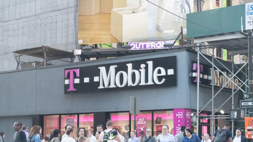 People walking by a T Mobile store in Manhattan.