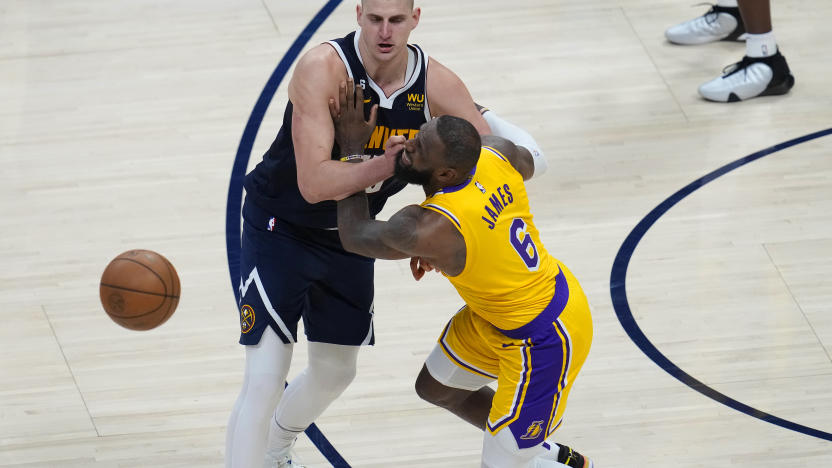 Los Angeles Lakers forward LeBron James (6) collides with Denver Nuggets center Nikola Jokic (15) during the second half of Game 2 of the NBA basketball Western Conference Finals series, Thursday, May 18, 2023, in Denver. (AP Photo/David Zalubowski)