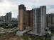 China's new home prices inch up for 9th month in May, survey shows