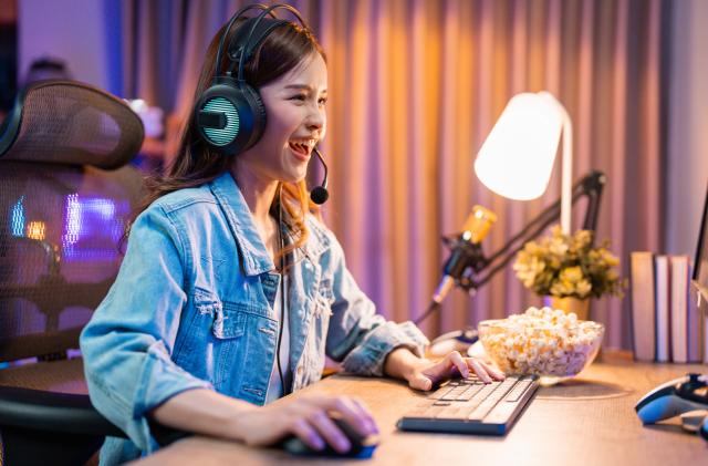 Young eSports woman player competing at an eSports event in her room