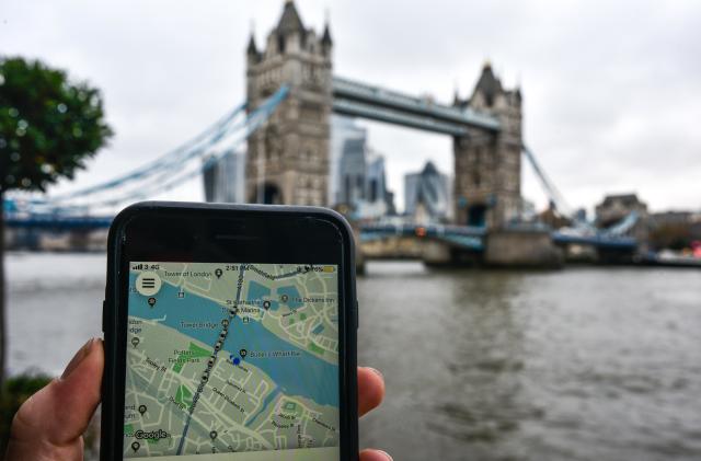 LONDON, ENGLAND - NOVEMBER 25: In this photo illustration the Uber logo is displayed on a phone in front of Tower Bridge on November 25, 2019 in London, England. Transport for London announced today, Monday, that Uber's license won't be renewed after it expires at the end of this month, November. Uber announced that they will appeal the decision. (Photo by Peter Summers/Getty Images)