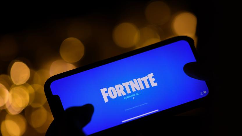 This illustration picture shows a person logging into Epic Games' Fortnite on their smartphone in Los Angeles on August 14, 2020. - Apple and Google on August 13, 2020 pulled video game sensation Fortnite from their mobile app shops after its maker Epic Games released an update that dodges revenue sharing with the tech giants. (Photo by Chris DELMAS / AFP) (Photo by CHRIS DELMAS/AFP via Getty Images)