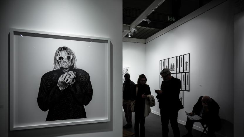 Visitors stand next to a photograph of late US singer Kurt Cobain by Dutch photographer Anton Corbijn during the opening of the 20th edition of Paris photo, the international fine art photography fair at the Grand Palais in Paris on November 9, 2016. 
The fair runs from November 10 to 13, 2016.   / AFP / PHILIPPE LOPEZ / RESTRICTED TO EDITORIAL USE - MANDATORY MENTION OF THE ARTIST UPON PUBLICATION - TO ILLUSTRATE THE EVENT AS SPECIFIED IN THE CAPTION        (Photo credit should read PHILIPPE LOPEZ/AFP/Getty Images)