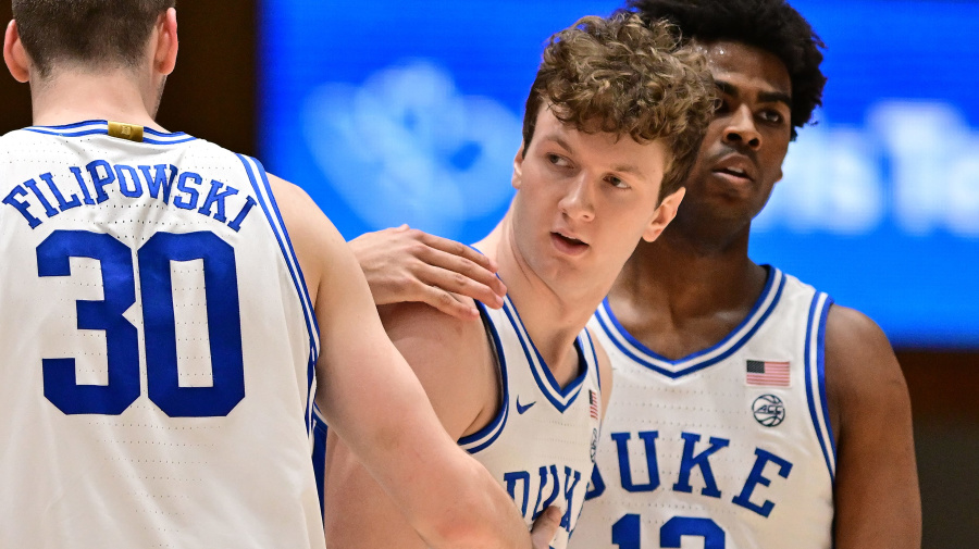 Getty Images - DURHAM, NORTH CAROLINA - FEBRUARY 28: Teammates huddle with TJ Power #12 of the Duke Blue Devils during the game against the Louisville Cardinalsat Cameron Indoor Stadium on February 28, 2024 in Durham, North Carolina. (Photo by Grant Halverson/Getty Images)