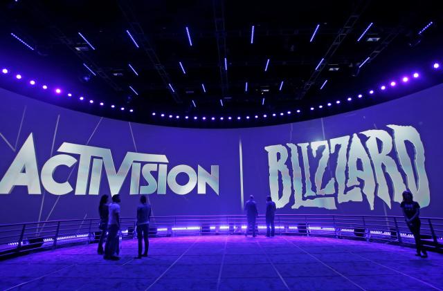 FILE - The Activision Blizzard Booth is shown on June 13, 2013 the during the Electronic Entertainment Expo in Los Angeles. Microsoft is buying Activision Blizzard, Tuesday, Jan. 18, 2022,  for $68.7 billion to gain access to blockbuster games including Call of Duty and Candy Crush. The all-cash deal will let Microsoft accelerate mobile gaming and provide it building blocks for the metaverse, or a virtual environment.