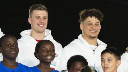 Getty Images - MIAMI, FL - JANUARY 27: Back row from left, San Francisco 49ers Defensive Tackle DeForest Buckner (99), Kansas City Chiefs Place Kicker Harrison Butker (7), Kansas City Chiefs Quarterback Patrick Mahomes (15), Kansas City Chiefs Safety Tyrann Mathieu (32), Kansas City Chiefs Punter Dustin Colquitt (2) and Kansas City Chiefs Linebacker Anthony Hitchens (53) pose with children and the Vince Lombardi Trophy during the NFL Super Bowl Opening Night at Marlins Park in Miami, Fla. on January 27, 2020 (Photo by Doug Murray/Icon Sportswire via Getty Images)