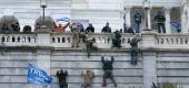 Trump supporters scale the west wall of the the U.S. Capitol. (AP)