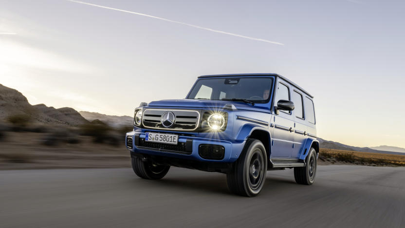 A blue all-terrain vehicle on the road.