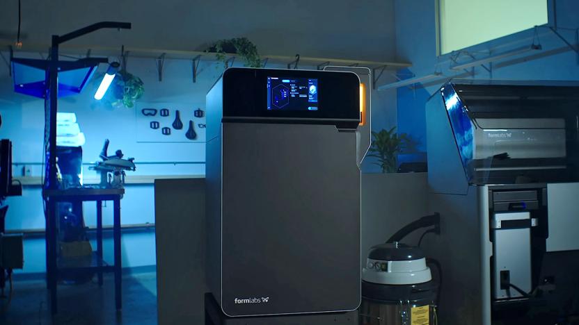The new Formlabs SLS 3D printer is shown in a work enivironment.