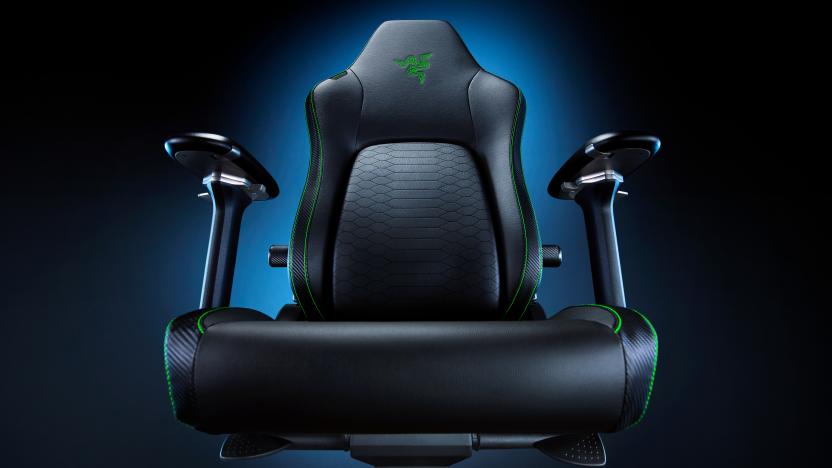 Product marketing photo of the Razer Iskur V2 Gaming Chair. Taken from a lower angle (just above the seat area), the dramatic shot has a blue glow fading to black behind the chair.