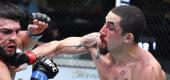 Robert Whittaker, right, punches Kelvin Gastelum in a middleweight fight during the UFC Fight Night event in Las Vegas. (Zuffa LLC)