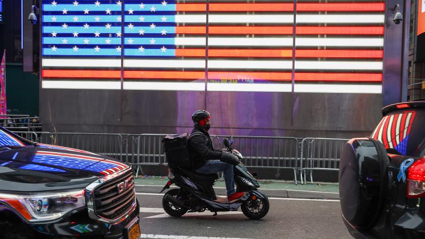 NEW YORK, NY - DECEMBER 29: A food delivery guy with scooter is seen at the Times Square in New York City, United States on December 29, 2021. (Photo by Tayfun Coskun/Anadolu Agency via Getty Images)