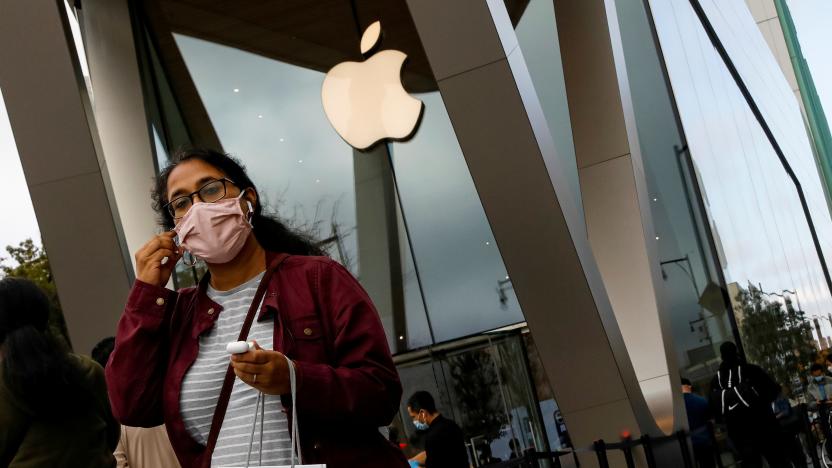 A customer exits after picking up Apple's new 5G iPhone 12 that went on sale, as the coronavirus disease (COVID-19) outbreak continues, at an Apple Store in Brooklyn, New York, U.S. October 23, 2020.  REUTERS/Brendan McDermid