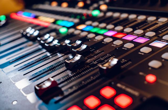 Studio mixing panel.Sound Mixer, Audio Mixer Slide. Music equipment blurred background.