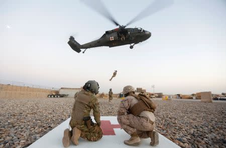 As Washington ponders Afghan mission, Marines toil in Helmand