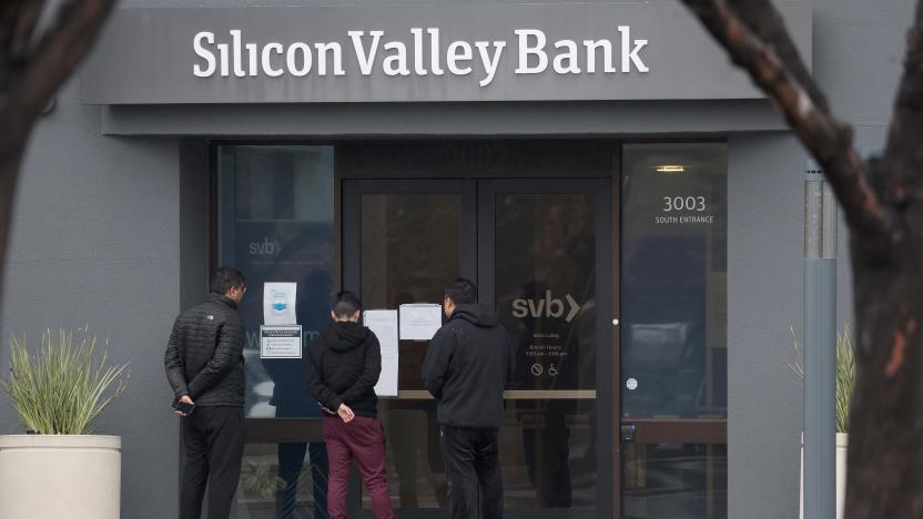 SANTA CLARA, CALIFORNIA - MARCH 10: Employees stand outside of the shuttered Silicon Valley Bank (SVB) headquarters on March 10, 2023 in Santa Clara, California. Silicon Valley Bank was shut down on Friday morning by California regulators and was put in control of the U.S. Federal Deposit Insurance Corporation. Prior to being shut down by regulators, shares of SVB were halted Friday morning after falling more than 60% in premarket trading following a 60% declined on Thursday when the bank sold off a portfolio of US Treasuries and $1.75 billion in shares to cover  declining customer deposits. (Photo by Justin Sullivan/Getty Images)