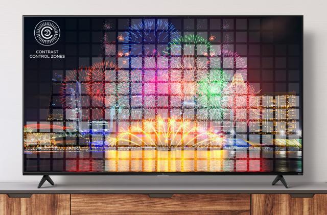 A picture of fireworks displayed on TCL's 5-Series 4K Roku TV as it rests on a stand.