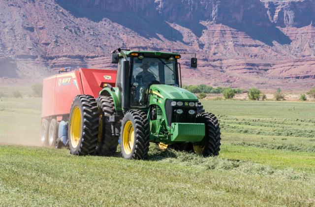 Baling hay with a John Deere 7930 tractor and a GPT Twin Pak baler on a ranch in southern Utah. (Photo by: Jon G. Fuller/VW Pics/Universal Images Group via Getty Images)