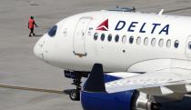 A Delta Air Lines jet leaves the gate, Friday, July 19, 2024, at Logan International Airport in Boston. (AP Photo/Michael Dwyer)