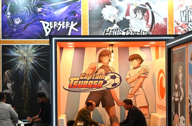 LONDON, ENGLAND - OCTOBER 04: Captain Tsubasa, Berserk and Hell's Paradise characters are displayed at the Crunchyroll stand during the Brand Licensing Europe at ExCel on October 04, 2023 in London, England. Brand Licensing Europe (BLE) event is dedicated to licensing and brand extension, bringing together retailers, licensees and manufacturers for three days of deal-making, networking and trend spotting. (Photo by John Keeble/Getty Images)