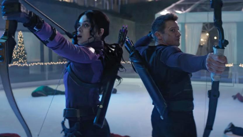 A still from the Disney/Marvel TV series 'Hawkeye' showing two archers standing back to back with fallen adversaries all around them.