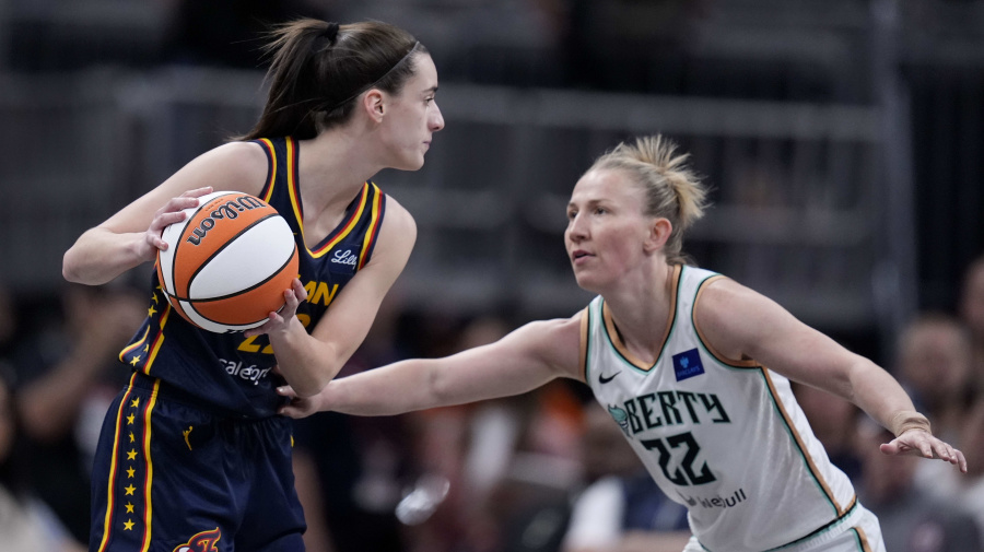 Associated Press - Indiana Fever guard Caitlin Clark, left, looks to pass around New York Liberty guard Courtney Vandersloot in the first half of a WNBA basketball game, Thursday, May 16, 2024, in Indianapolis. (AP Photo/Michael Conroy)