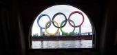 The Olympic rings are seen from a window of a water bus in Tokyo. (AP)