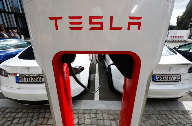 The company logo of Tesla cars is seen on the V3 supercharger equipment during the presentation of the new charge system in the EUREF campus in Berlin, Germany September 10, 2020. REUTERS/Michele Tantussi