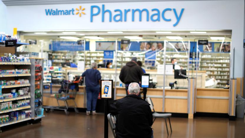 A person waits at a Walmart Pharmacy where the Moderna coronavirus disease (COVID-19) vaccine is available as Walmart and other major U.S. pharmacies take part in the Federal Retail Pharmacy Program, to increase vaccinations in the U.S. in West Haven, Connecticut, U.S., February 17, 2021. REUTERS/Mike Segar