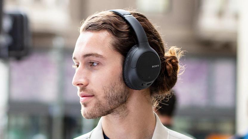 A person wearing Sony's WH-CH710N headphones.