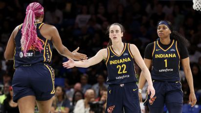 Getty Images - ARLINGTON, TEXAS - MAY 03: Caitlin Clark #22 of the Indiana Fever high-fives Aliyah Boston #7 after a basket against the Dallas Wings during the second quarter in the preseason game at College Park Center on May 03, 2024 in Arlington, Texas.  (Photo by Gregory Shamus/Getty Images)