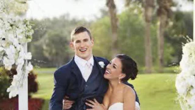 Paralyzed college football player walks down aisle at his wedding