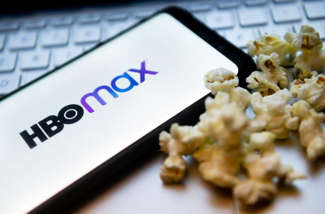 POLAND - 2022/02/03: In this photo illustration a HBO Max logo seen displayed on a smartphone
with popcorns and laptop keyboard in the background. (Photo Illustration by Mateusz Slodkowski/SOPA Images/LightRocket via Getty Images)