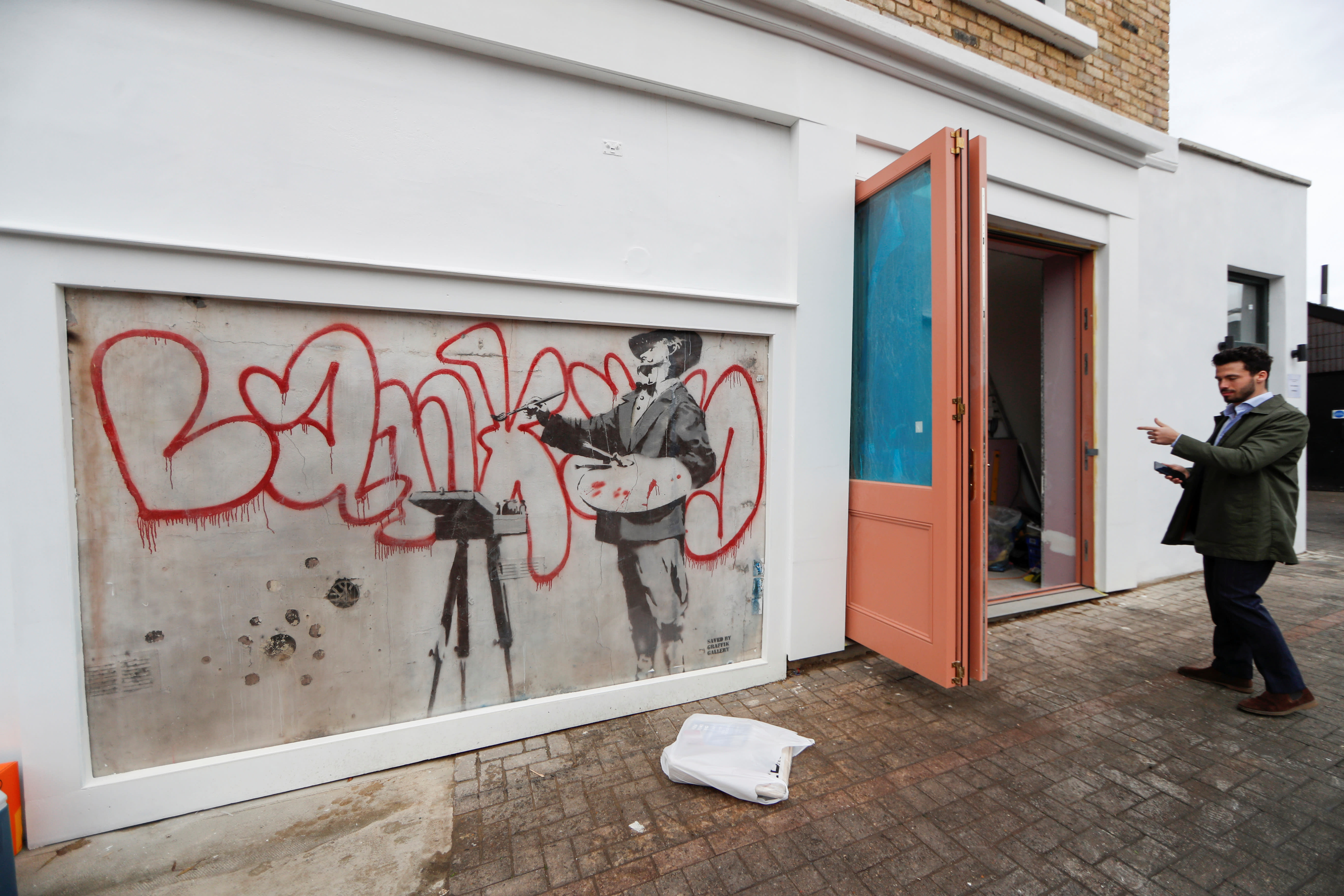 Banksy mural unveiled in London after being hidden by scaffolding